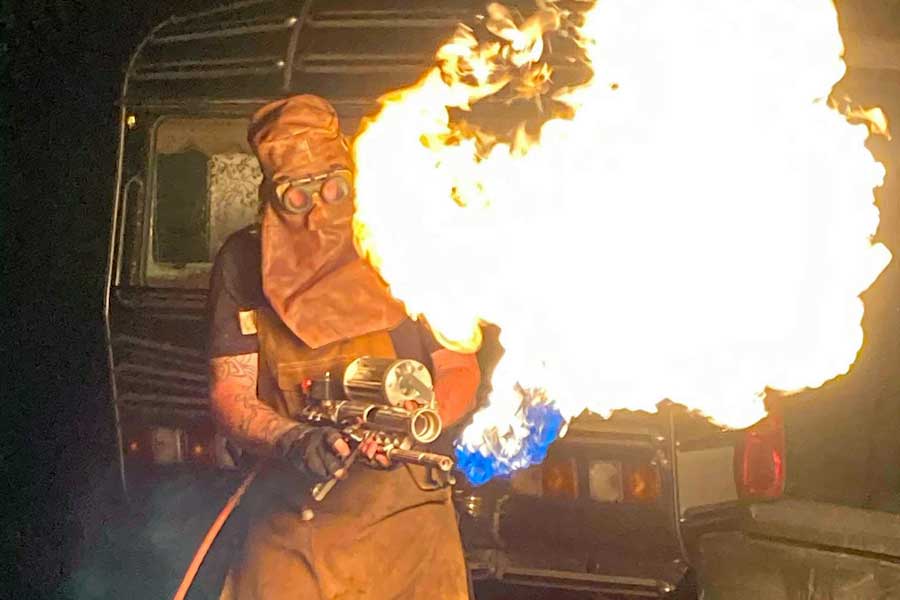 Iain Coiley with home-made flamethrower